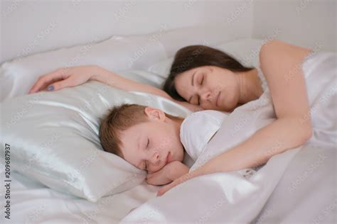 Mother on bed playing with her daughter. . Mom son sleeping porn